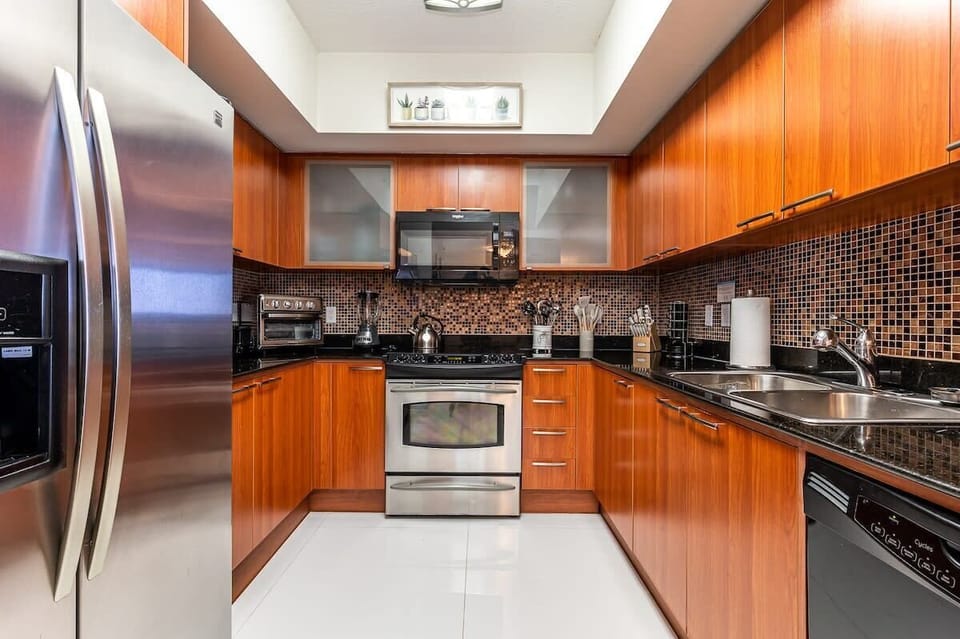Fully furnished kitchen with modern appliances and abundant counter space