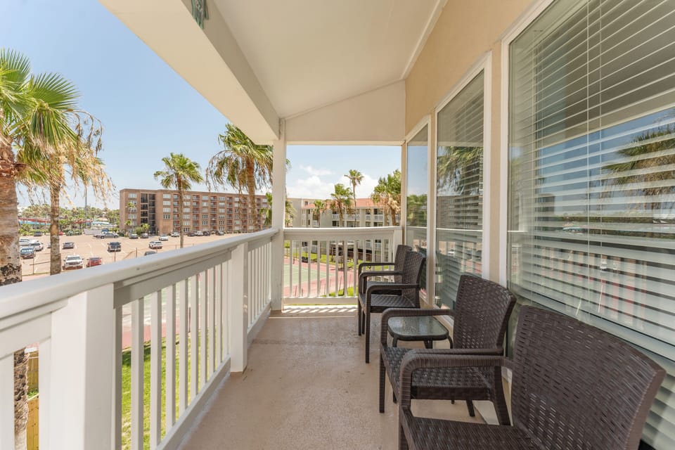 Our furnished private balcony is a cozy corner of paradise perfect for catching up on your reading list or conversation. Reserve your spot on the beach today!