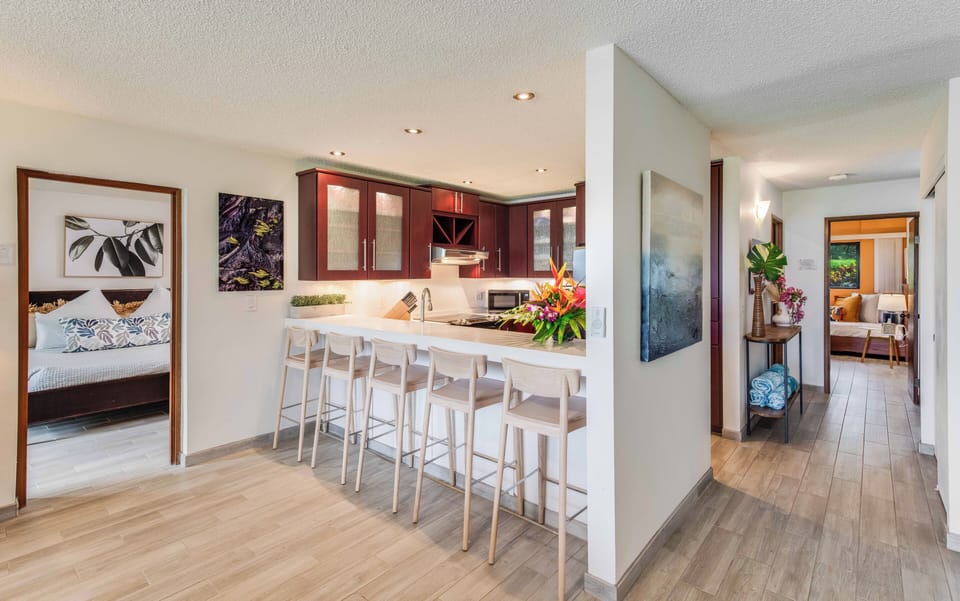 Step into comfort with an open layout featuring a modern kitchen and welcoming entry perfect for island living.