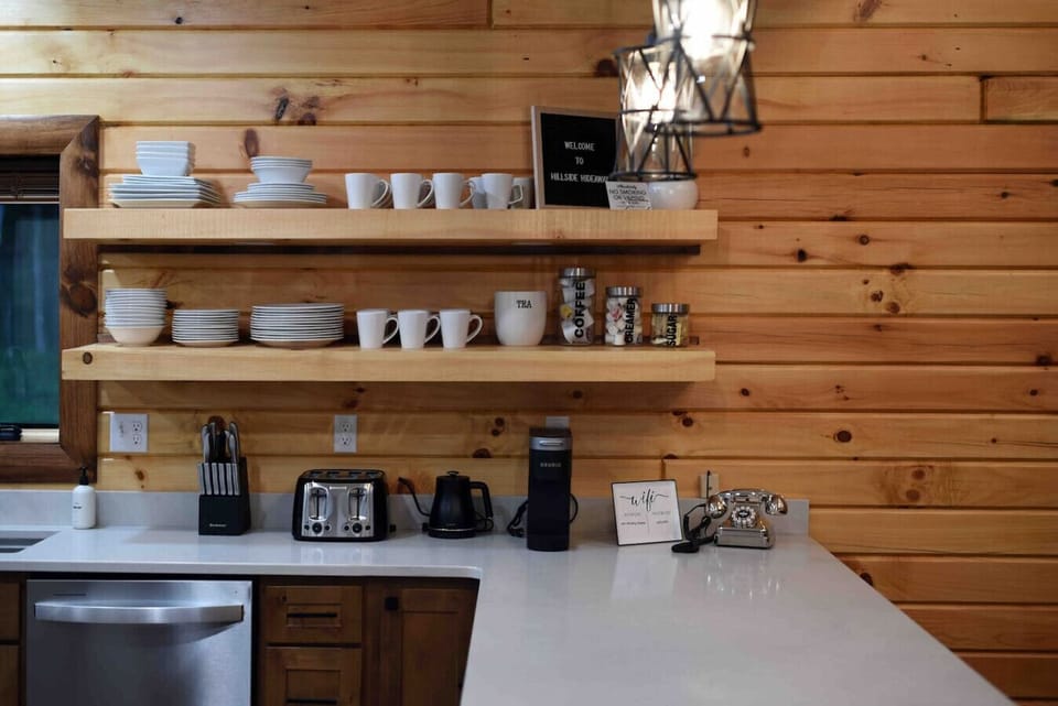 Fully stocked kitchen with everything you need for your morning tea or coffee (coffee pod, sugar, and creamer).