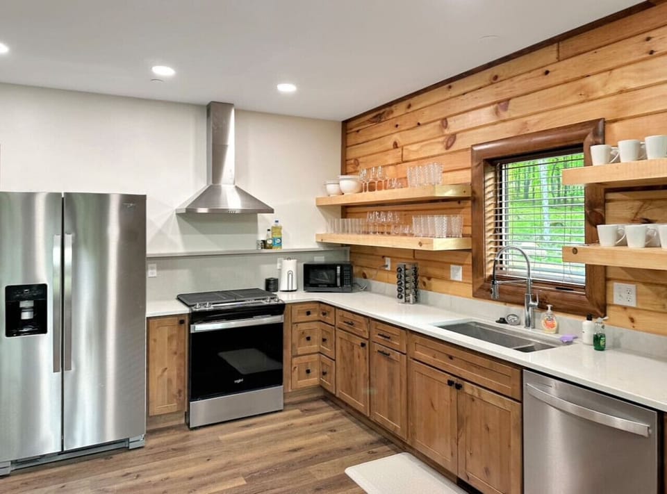 You’ll have everything you’ll need to cook a feast in your large kitchen, which included a gas stove, large dishwasher, and large refrigerator/freezer, and it comes full stocked with plates, cups, wine glasses, mugs, and more.