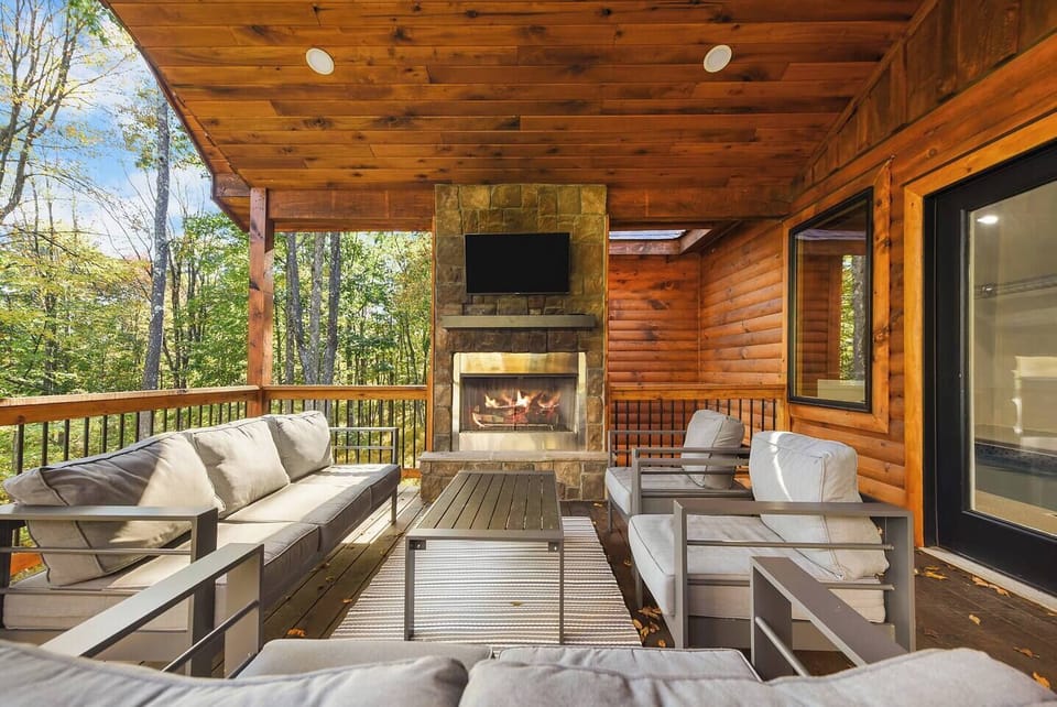 Right off of the pool room you can enjoy your own outdoor fireplace and smart tv 