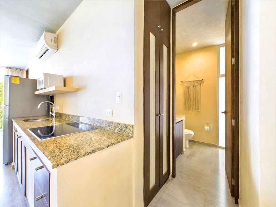 Extra half bath near kitchen adds convenience and guest privacy.