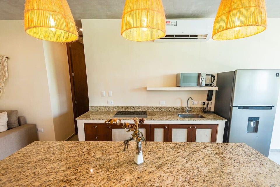 Spacious kitchen with bar stools—great for hanging out with friends.