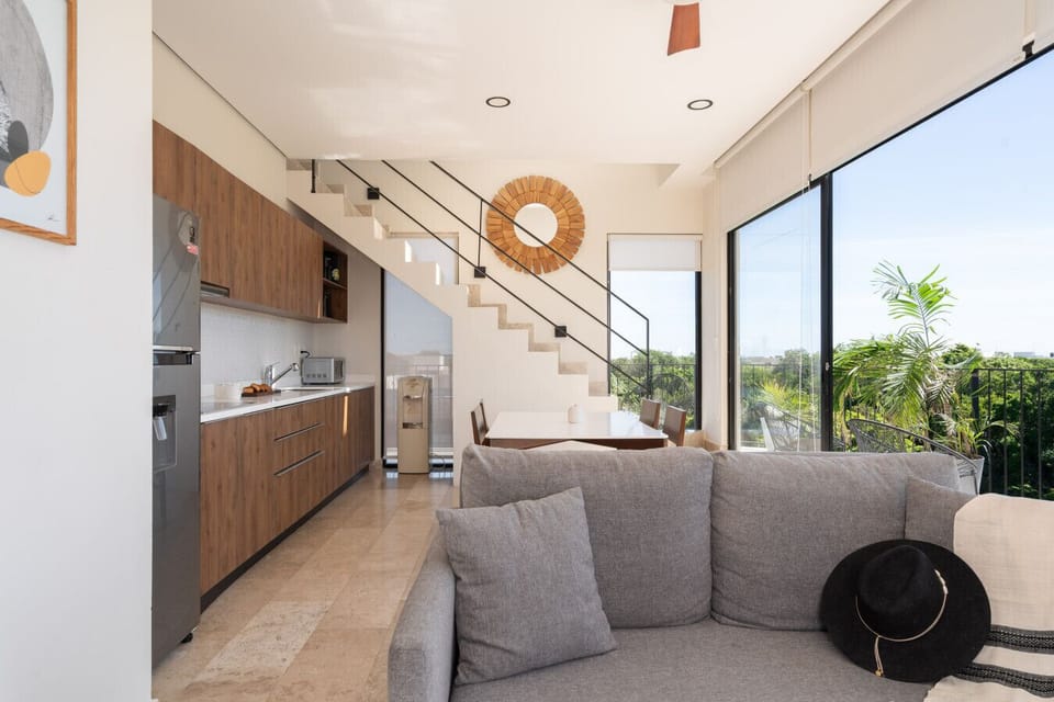 Bright open space combining comfort, style, and greenery views.