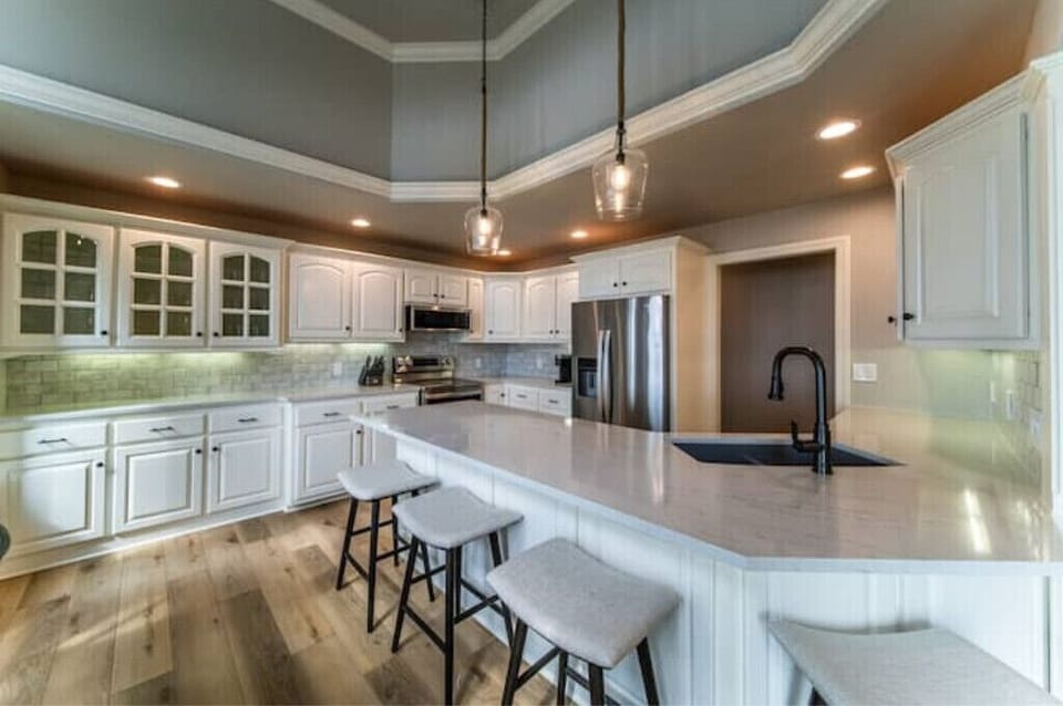 Fully stocked kitchen with appliances, cookware, and kids dinnerware.