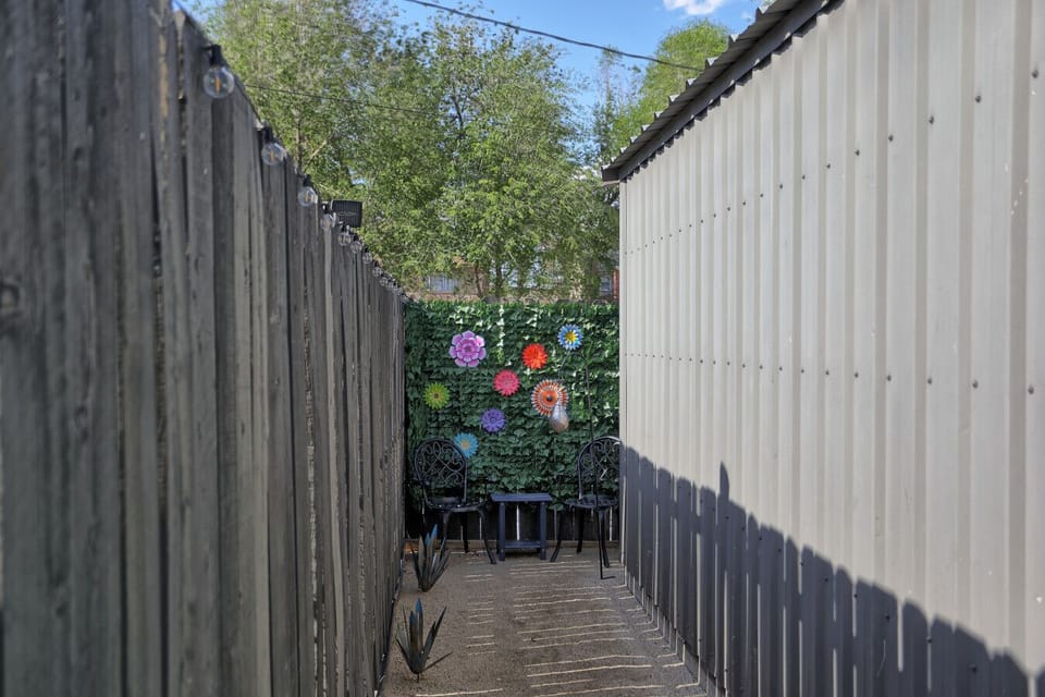 Beautiful corner with a floral backdrop to sit and unwind.