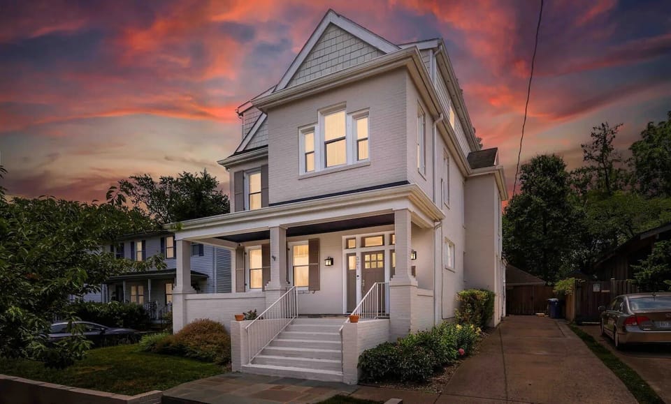 Charming, newly renovated home with modern finishes and a welcoming front porch.
