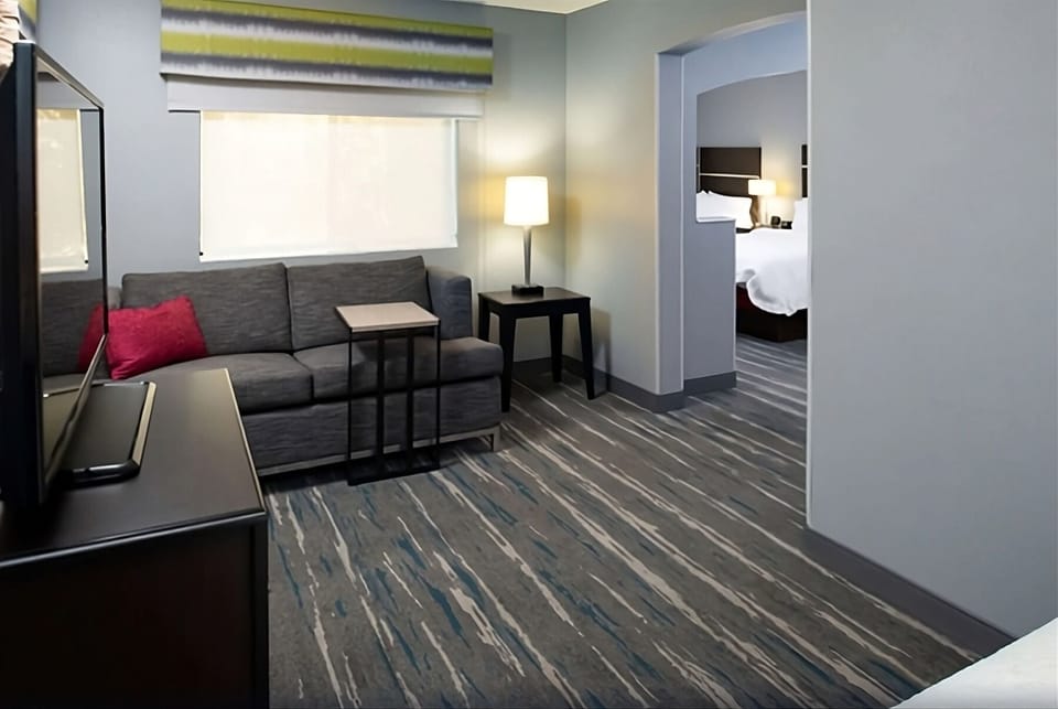 Relax in the lounge area with warm lamp-lit ambiance.