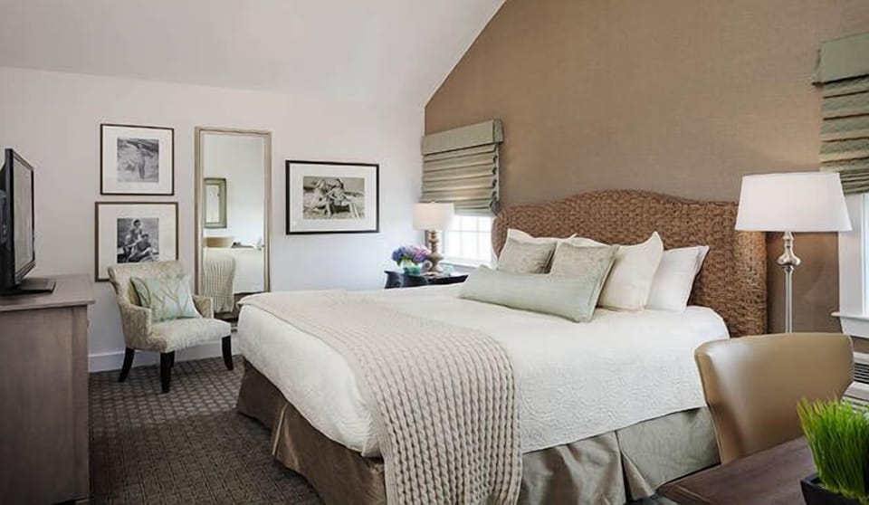 Unwind in a serene king bed with soft linens.