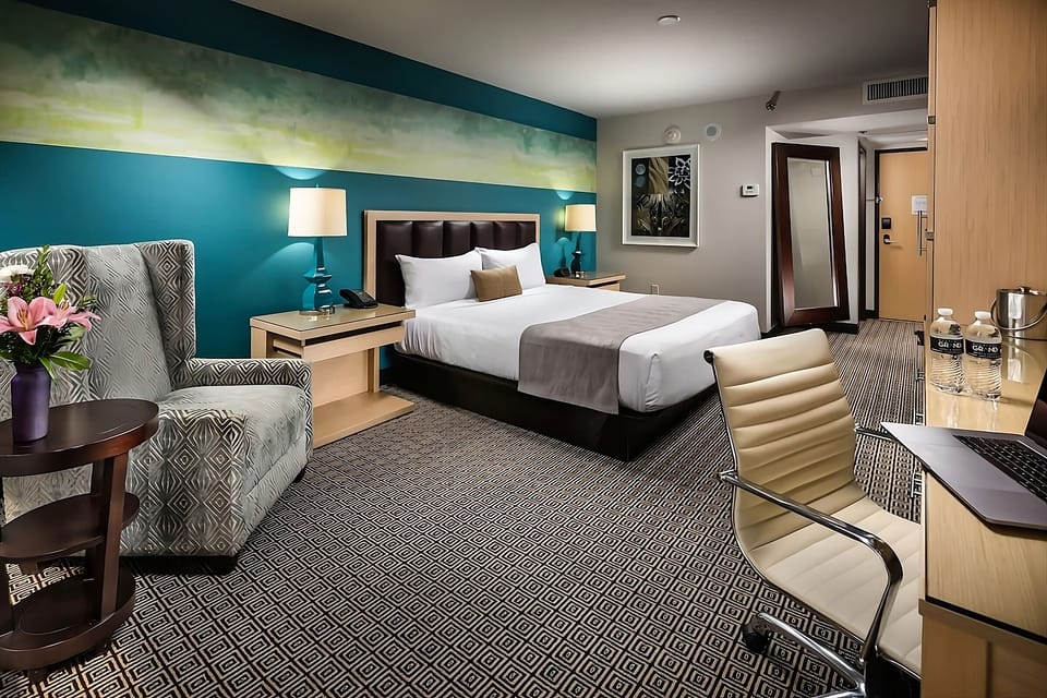 Settle into a cozy room with workspace and plush seating.