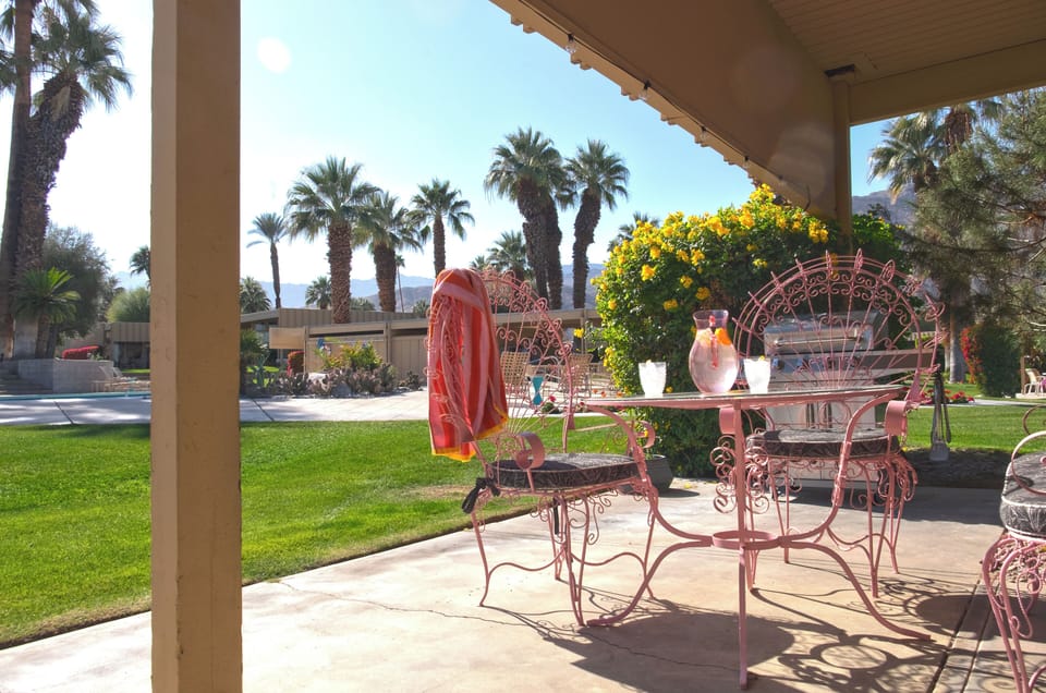Patio with grill, just steps from the heated pool