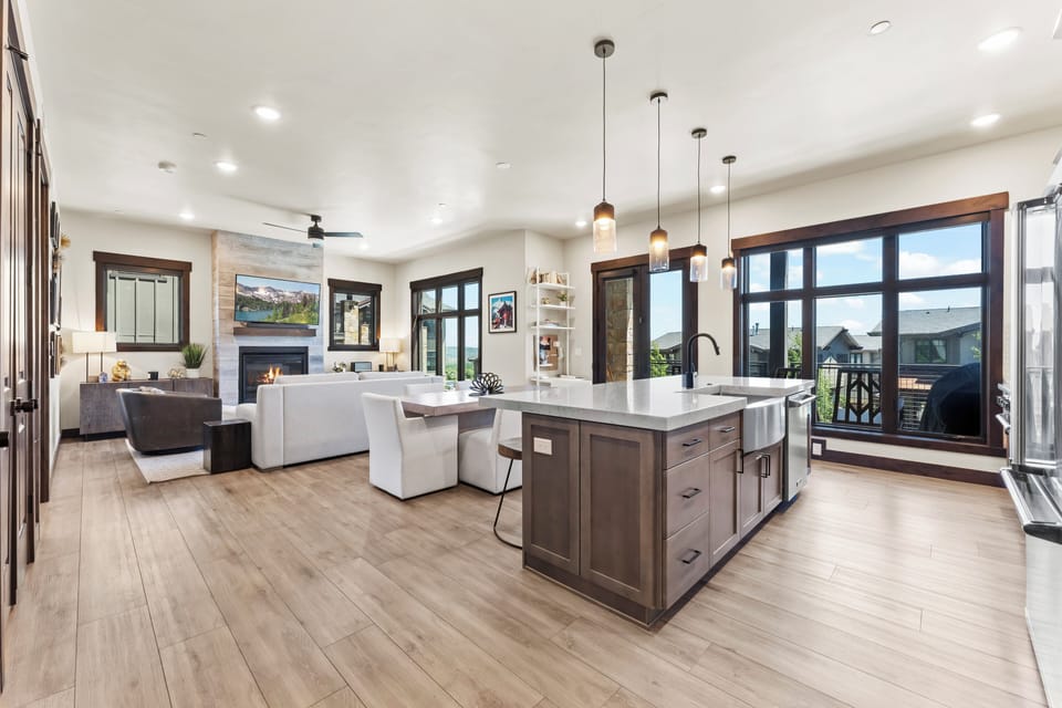Bright open-concept kitchen and living area with modern finishes, creating a spacious and inviting environment.