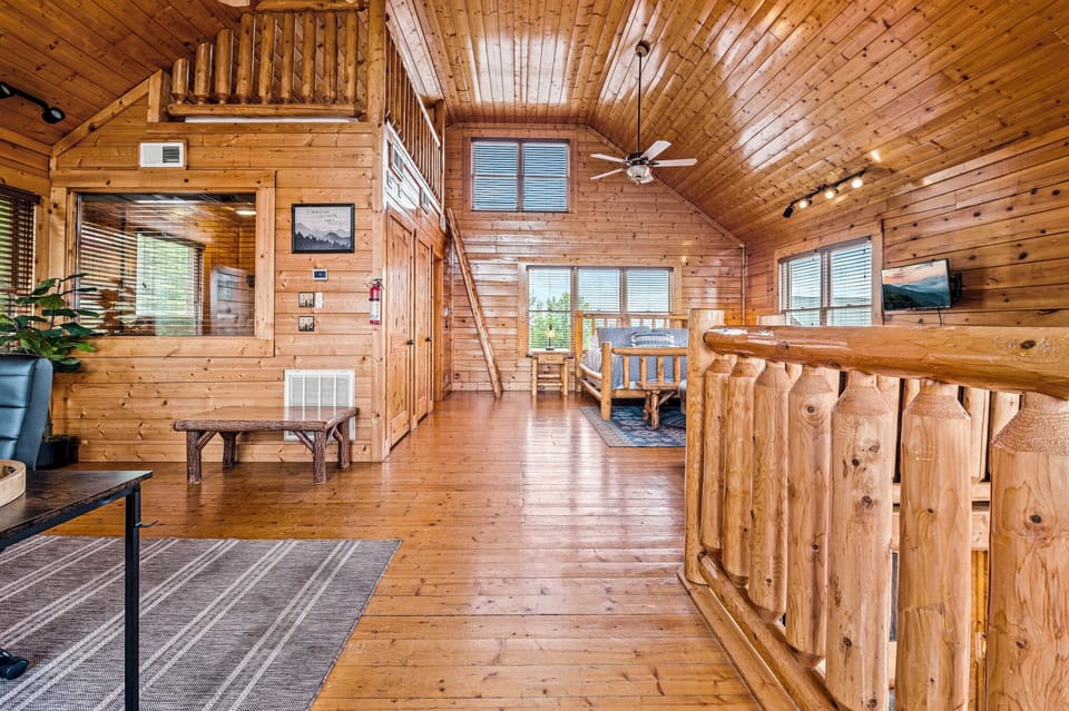 Upper-level loft with king bed, working space, queen sofa bed, and crow's nest