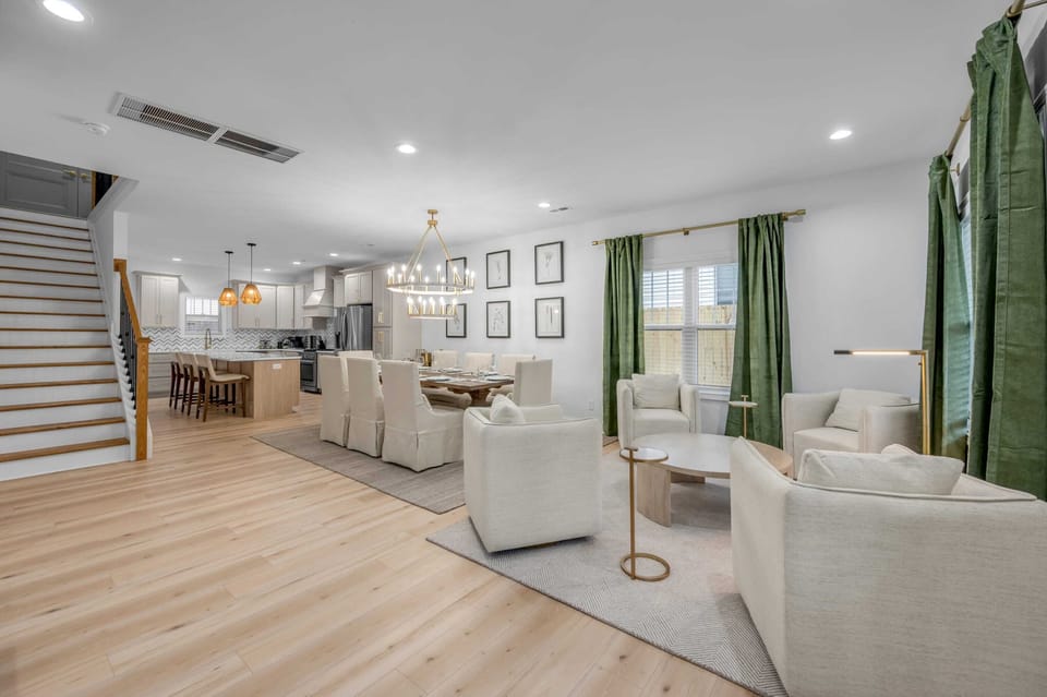 This inviting living room features tasteful decor, a smart TV for entertainment, and plush seating to keep you comfortable from day to night.
