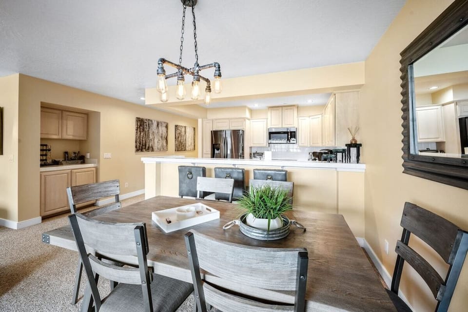 Your open-concept dining and kitchen space features rustic charm with modern amenities, perfect for gathering with loved ones.
