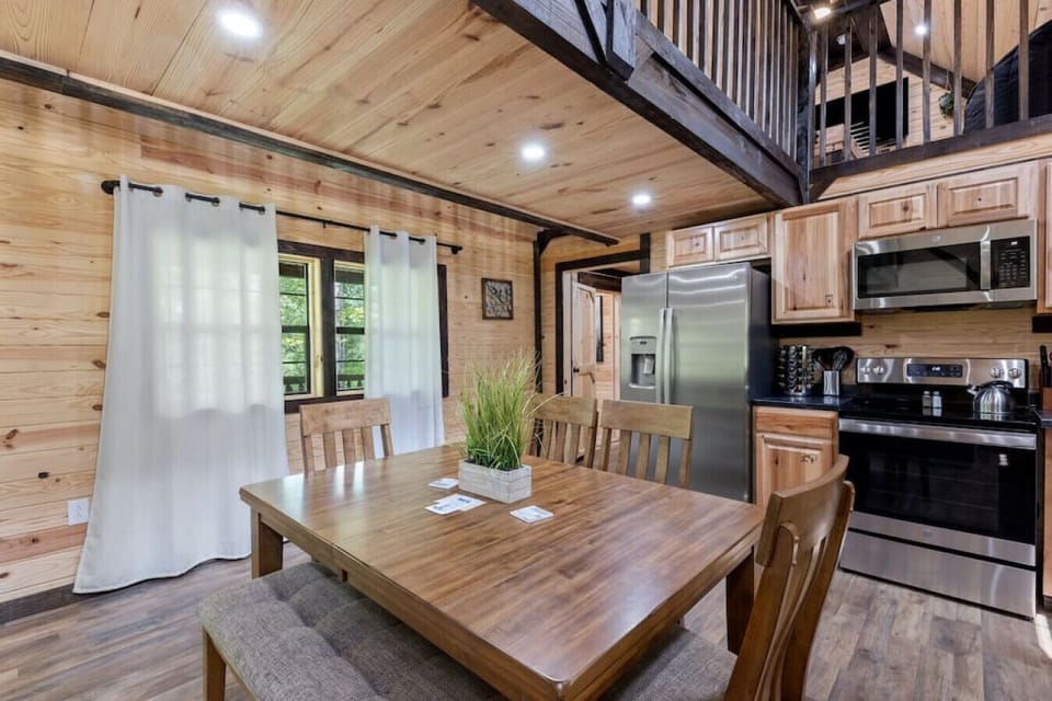 The dining table has seating for 6 people with direct sliding door access to the back deck.