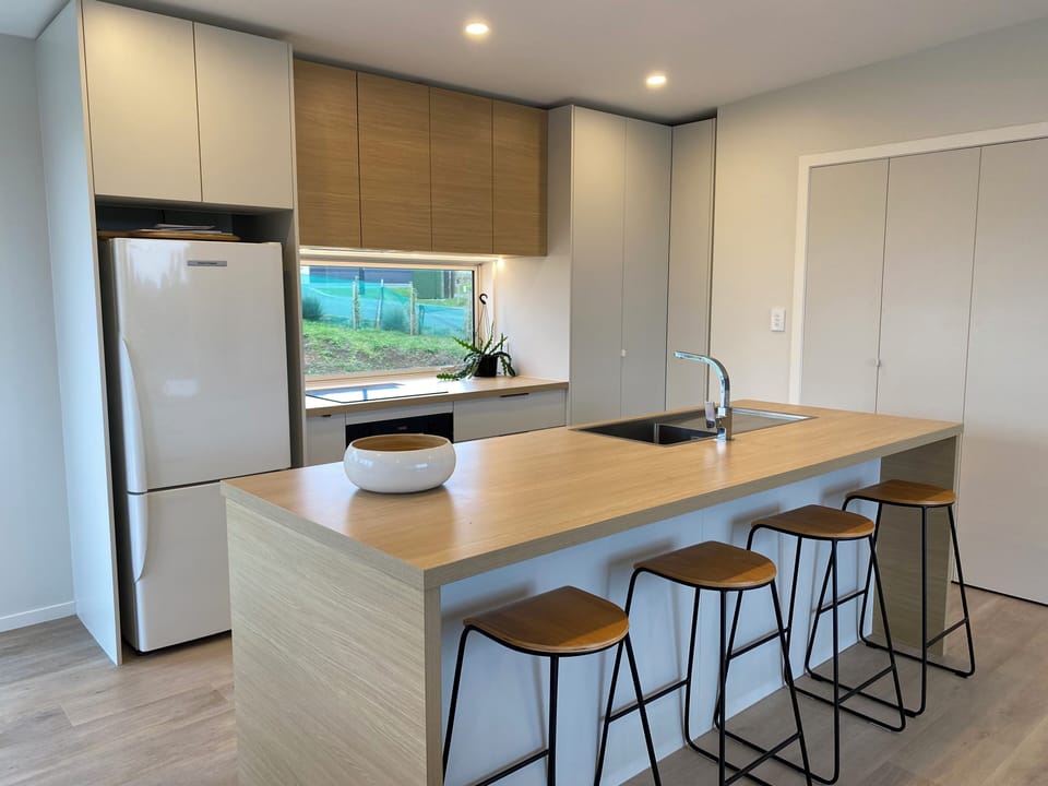The kitchen (and laundry in the cupboards to the right)