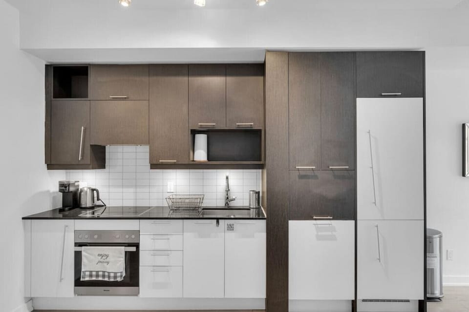 Fully equipped kitchen with all essential cooking and dining utensils.