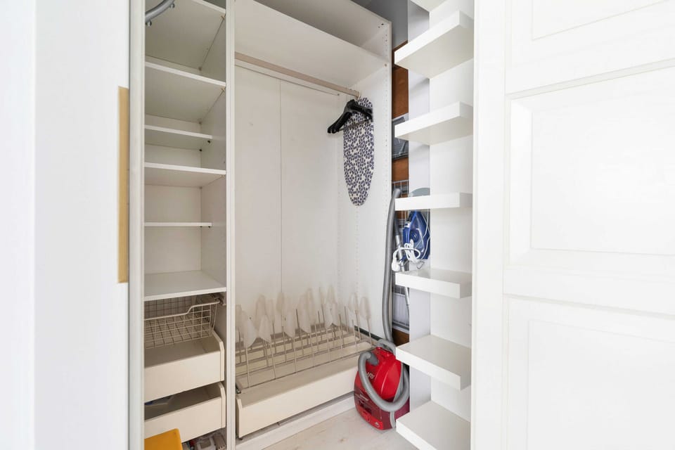 Spacious wardrobe with ample shelving and hanging space, perfect for organized storage.

