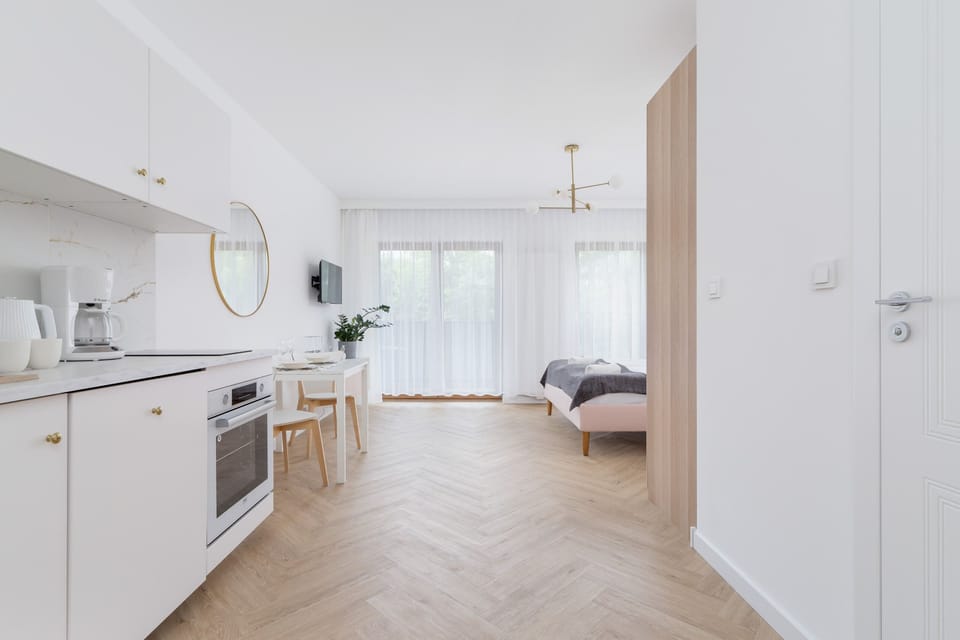 Compact and functional kitchen with a clean, minimalist design and modern appliances.

