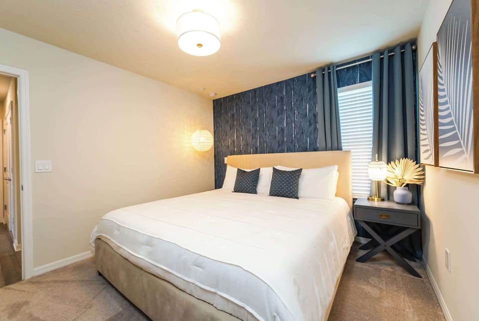 Relax in this stylish bedroom with modern decor and cozy ambiance, perfect for a restful night's sleep.