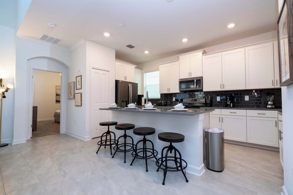 The open-concept kitchen keeps everyone connected. Grab a quick snack at the island or prep a gourmet meal while staying part of the conversation.