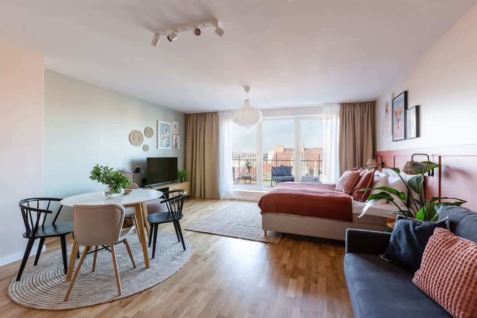 The main room is equipped with queen size bed and convertible sofa