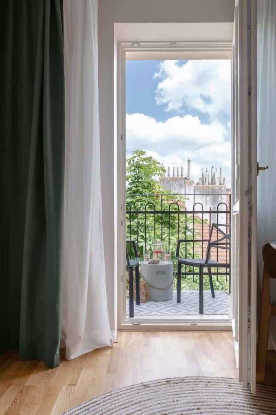 There is a private balcony with outdoor seating to enjoy sunny days