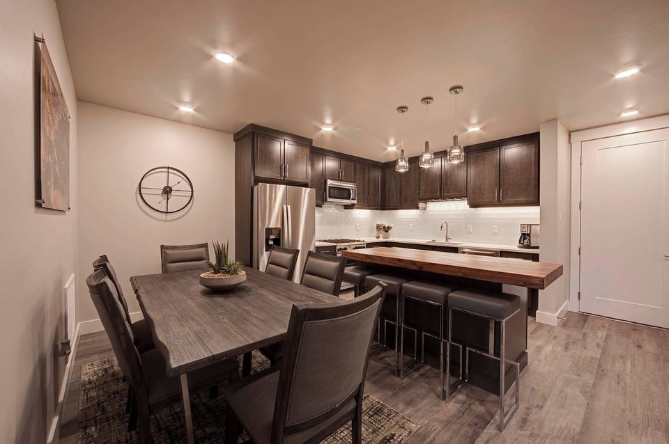 Plenty of seating options available at the dining table or kitchen island. (Photos don't depict actual furnishings in the unit)