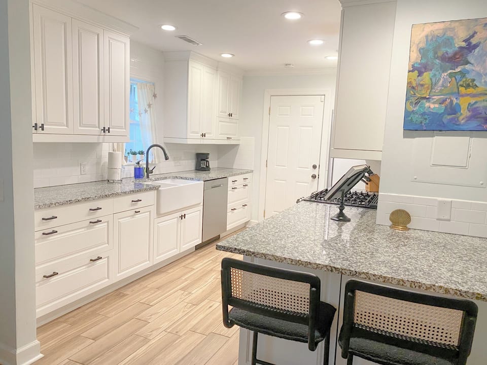 Modern, fully stocked kitchen with actual spices and utensils!
