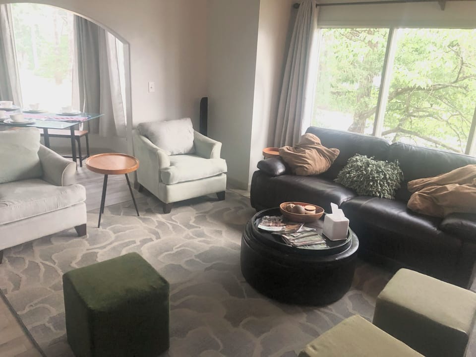 Spacious Open Floor plan living room with large leather recline sofa 