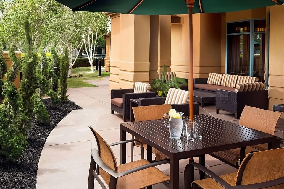 Sip morning coffee outside under shade in peaceful seating