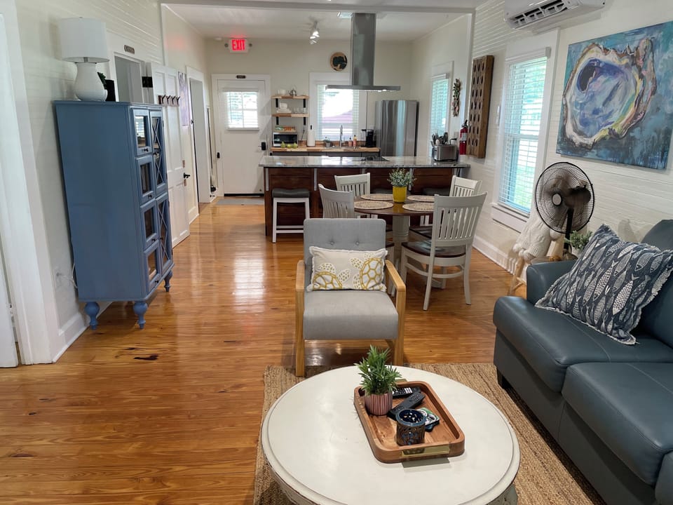 Great room with island bar and 60” smart TV. 