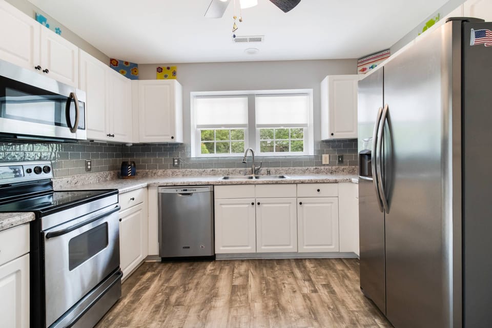The Windows allow Sunlight to Shine in while Delicious Meals are being Prepared.