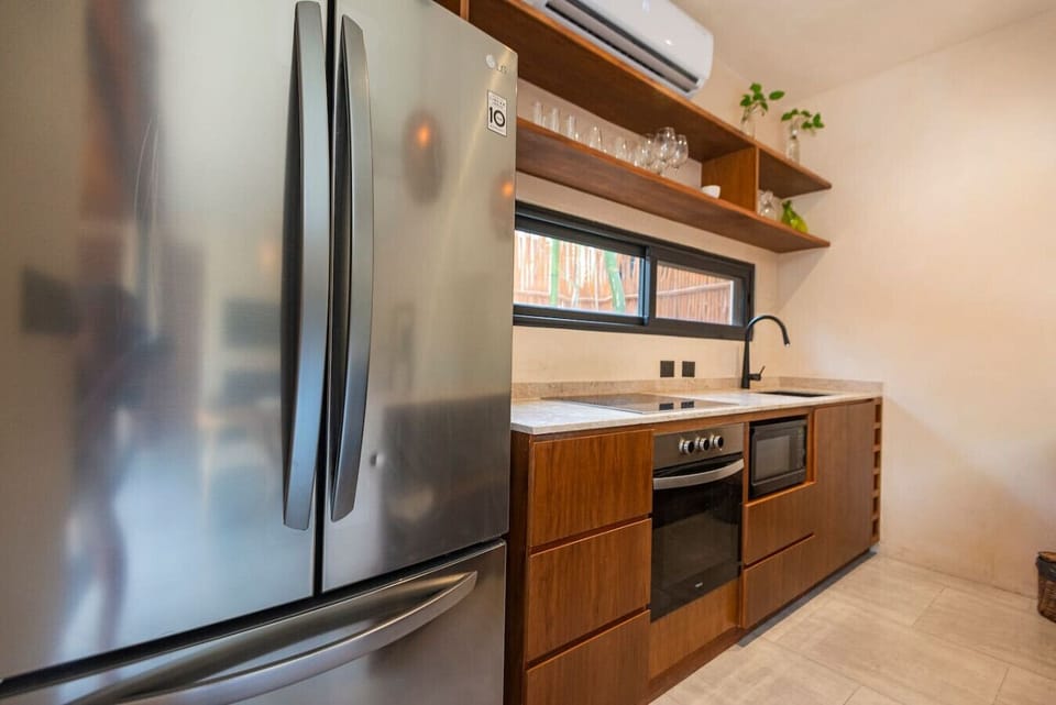 Bright kitchen w/ sleek wood accents & cozy window