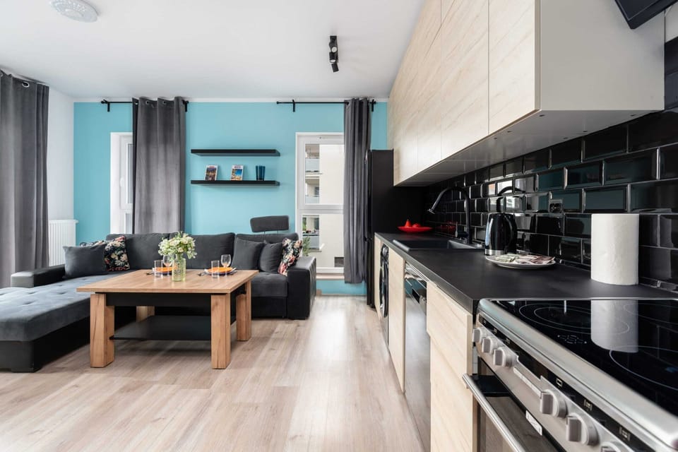 Another perspective of the living area showcasing the seamless integration of the kitchen and lounge.

