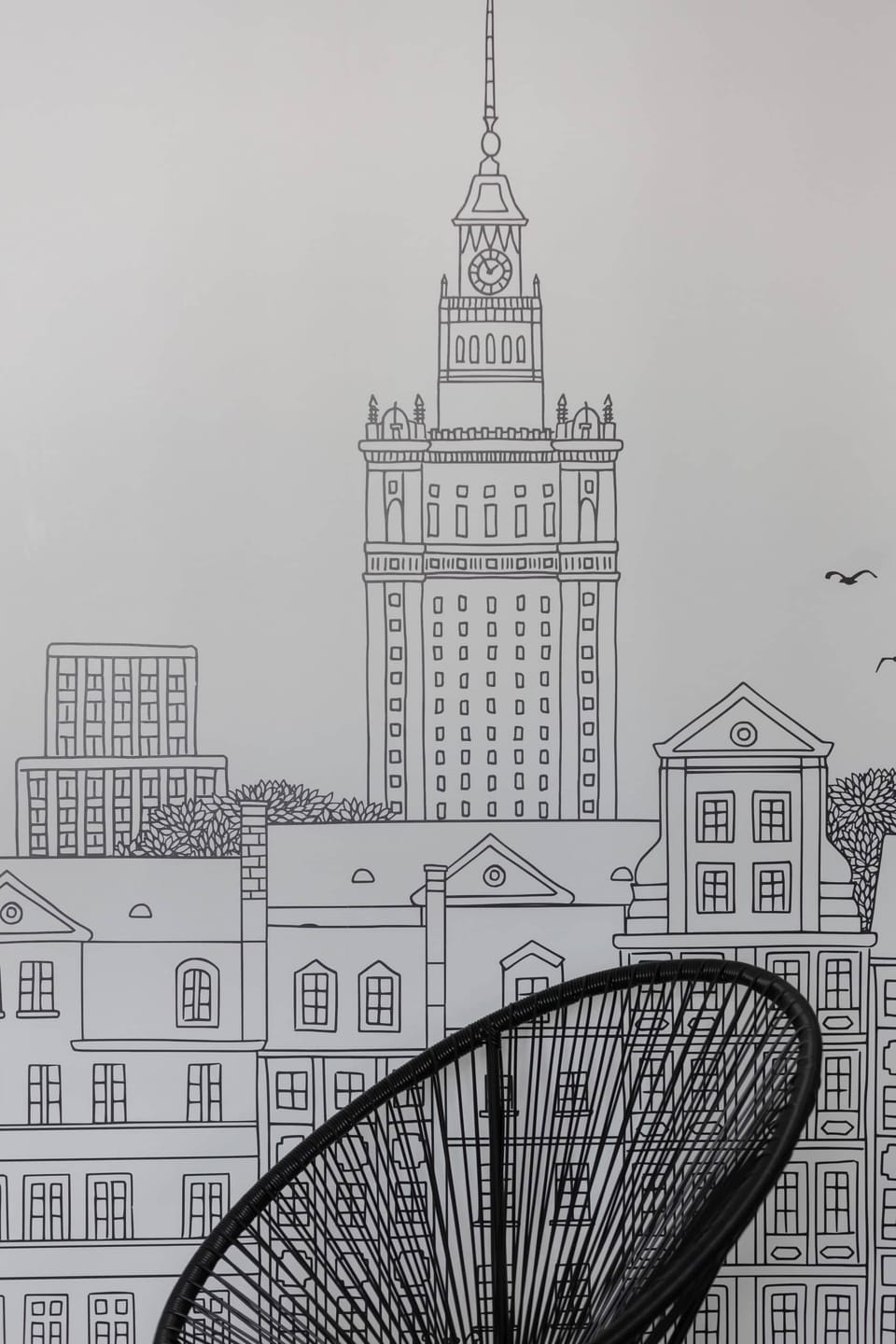 Wall mural of the Palace of Culture and Science, adding a unique artistic touch to the interior.

