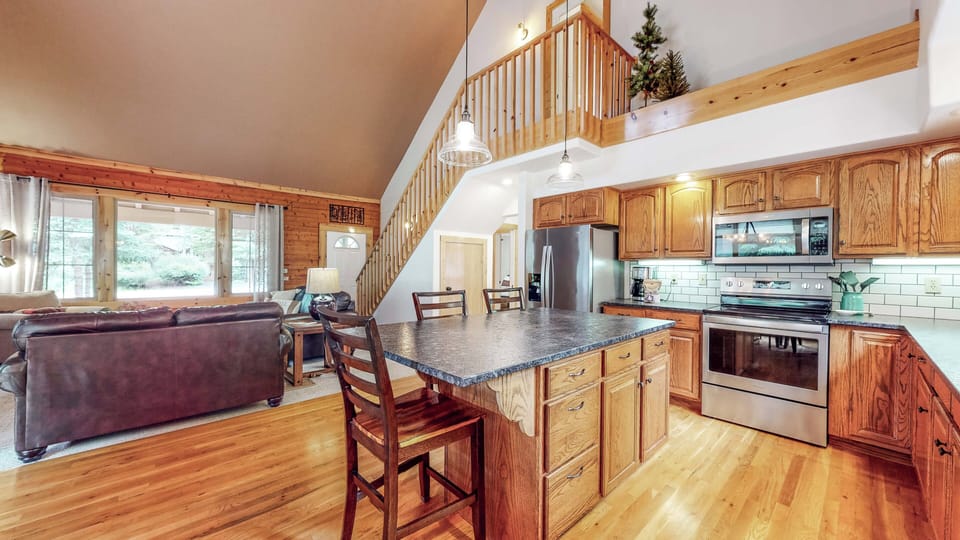 Room for everyone to gather, dining, kitchen island and family room