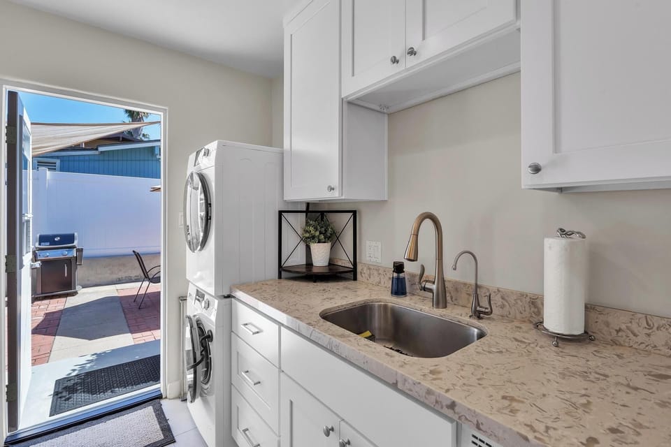 Kitchen: fully stocked with washer and dryer