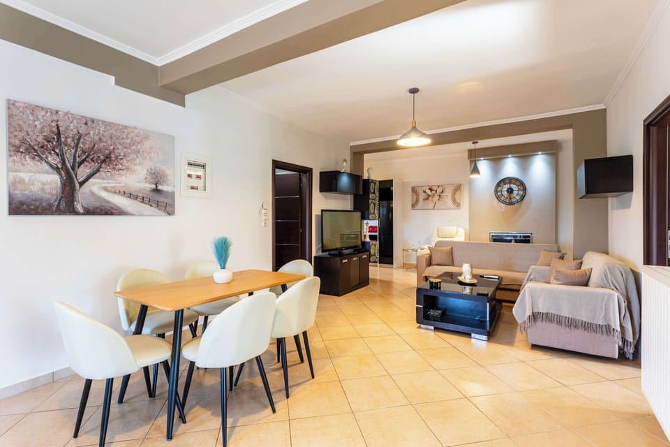 Spacious and Bright Living Room – Large windows fill the space with sunlight.