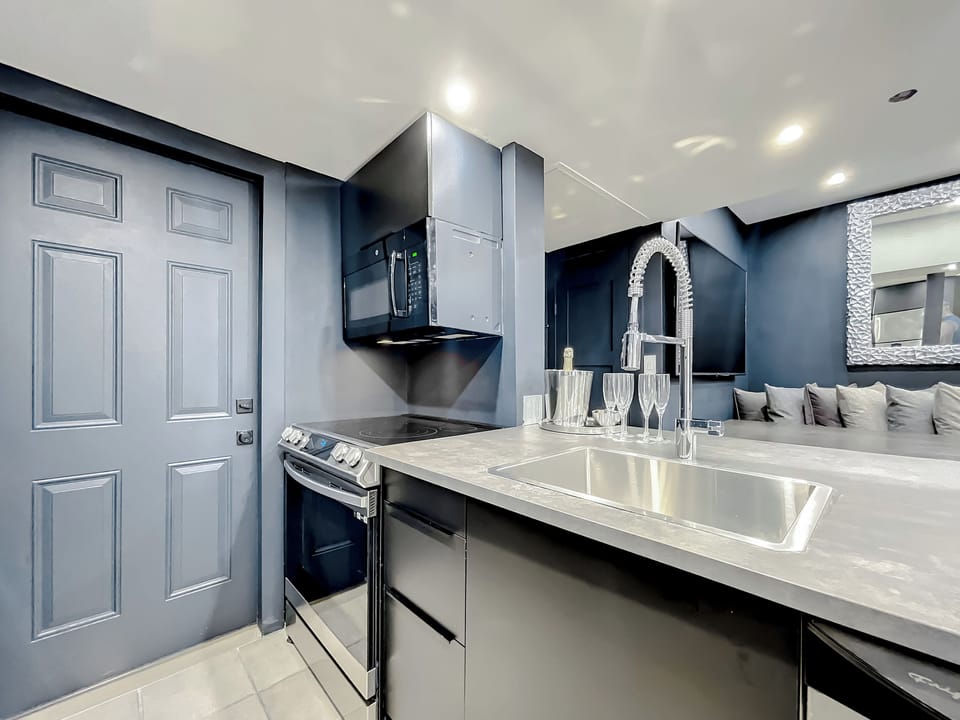 Entertain with big screens, a stone table for 12, and a fully-equipped kitchen