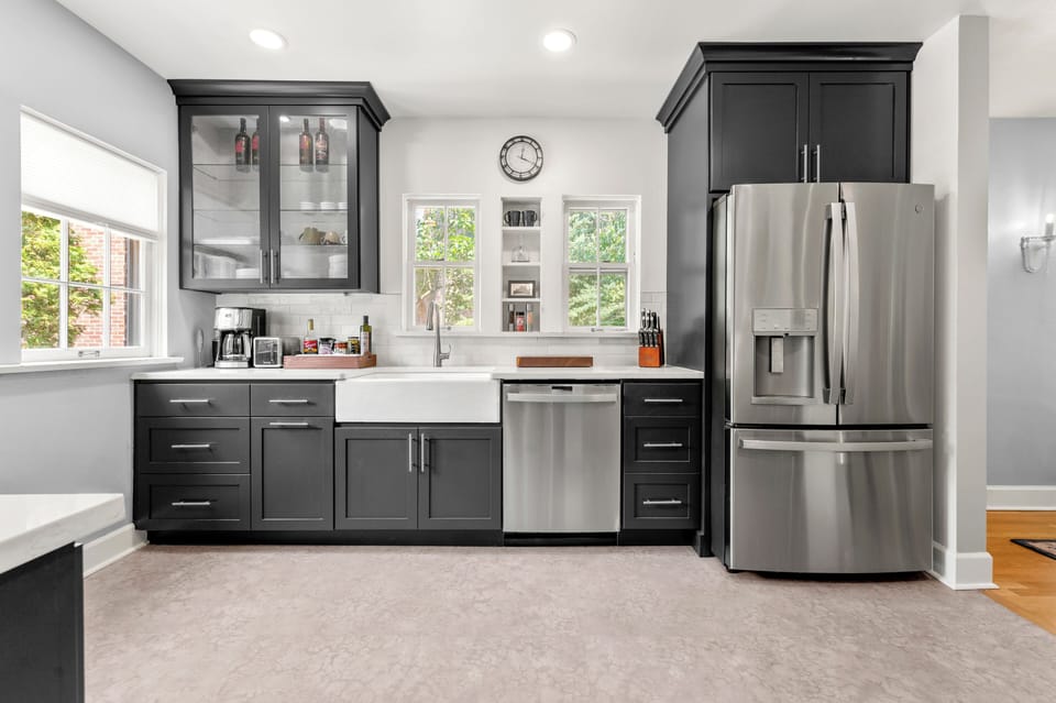 Custom cabinets and that farmhouse sink. GE Profile appliances through-out. 