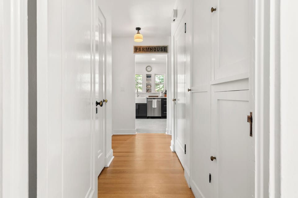 Hardwood floors refinished to perfection and access to the basement in this hall