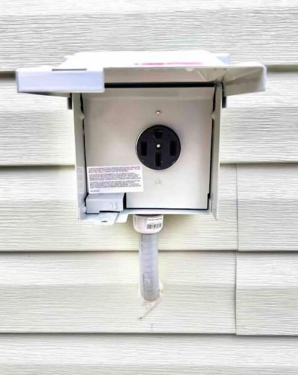 Bring your own mobile charger & hook up to our 220V NEMA 14-50 outlet.