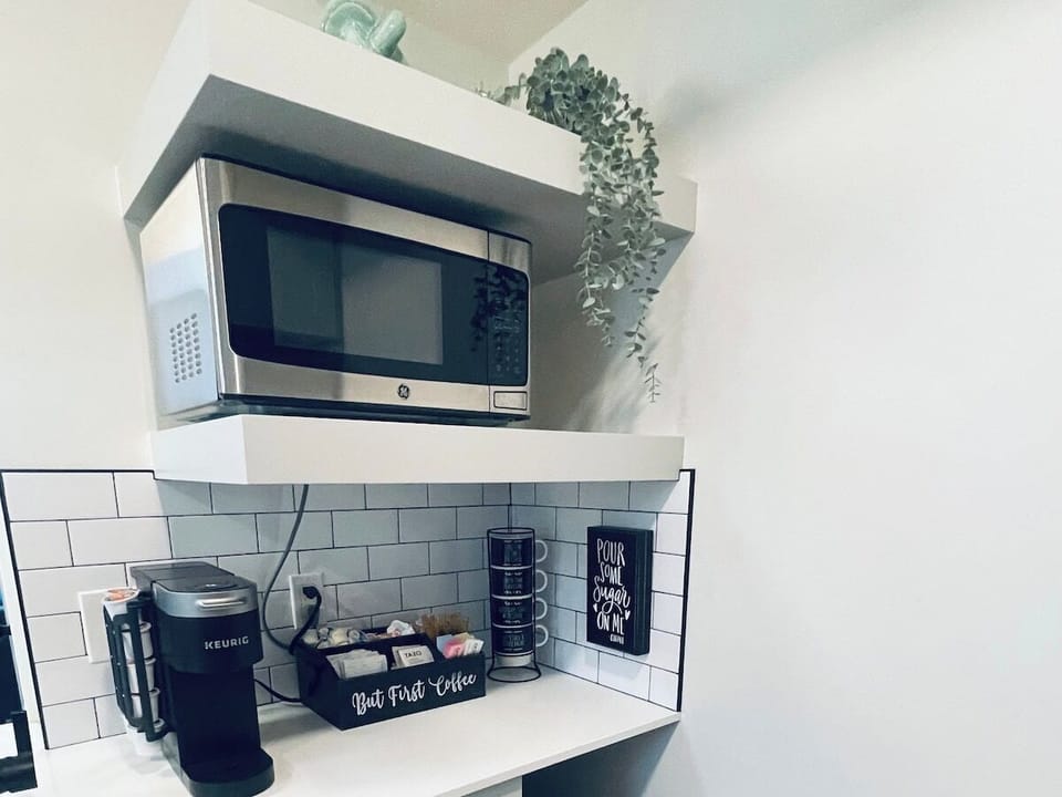 The kitchen is equipped with a 1000v microwave and all of your kitchen essentials.