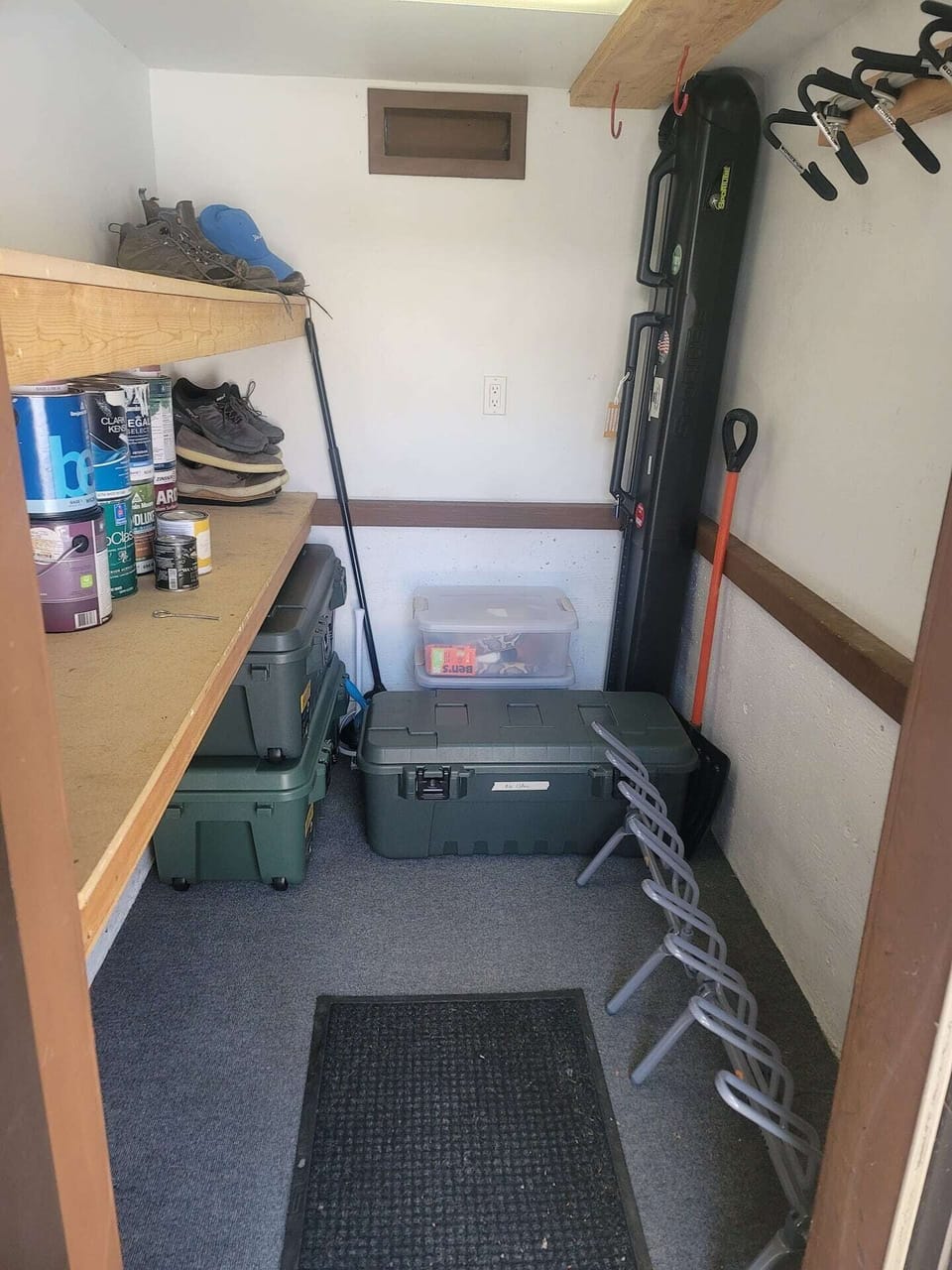 Storage closet for skis with boot warmers.