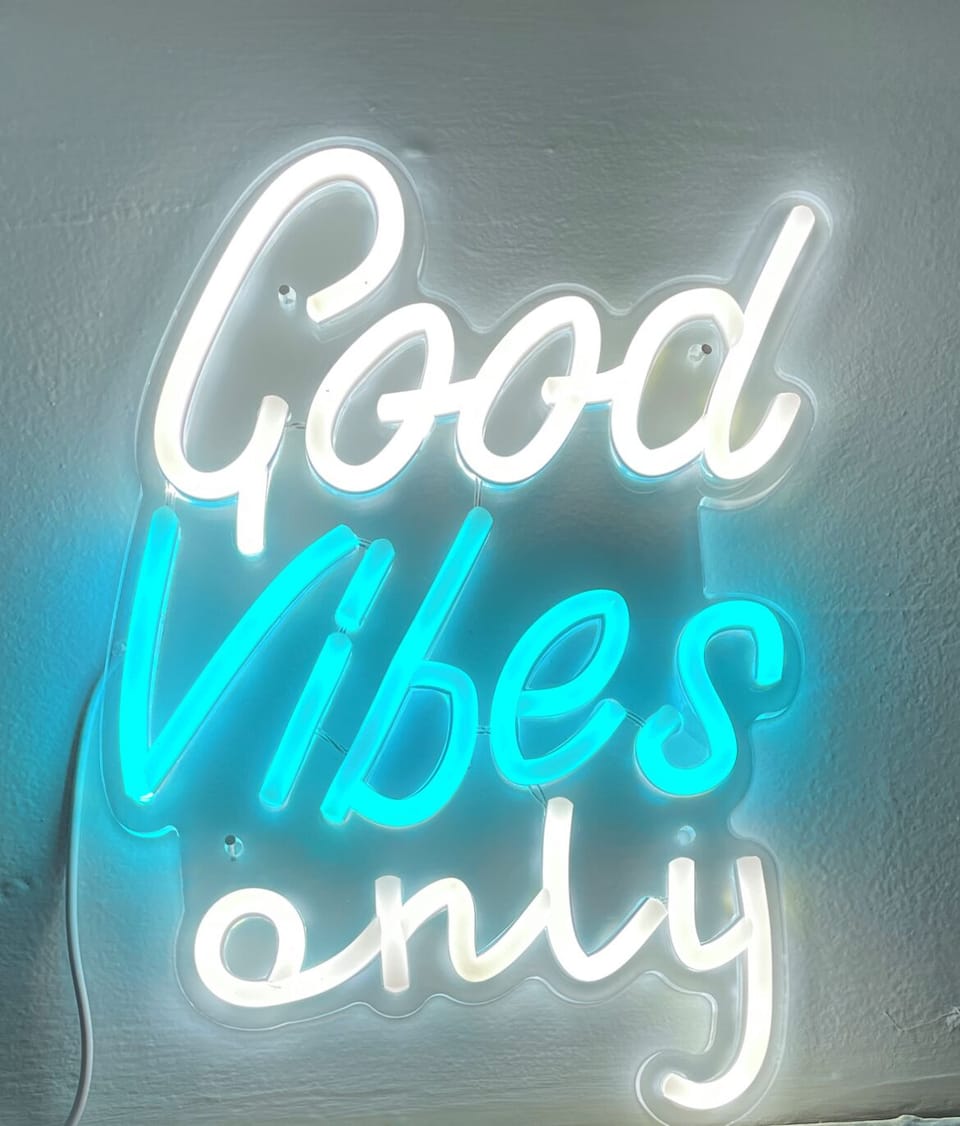 Turn out the lights, and enjoy this neon sign in the Teal Oasis!