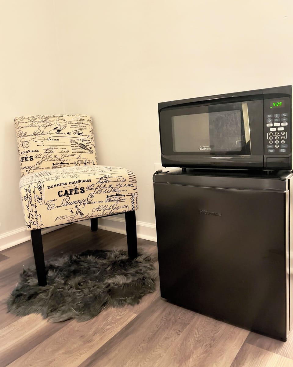 Master bedroom equipped with microwave and mini fridge!