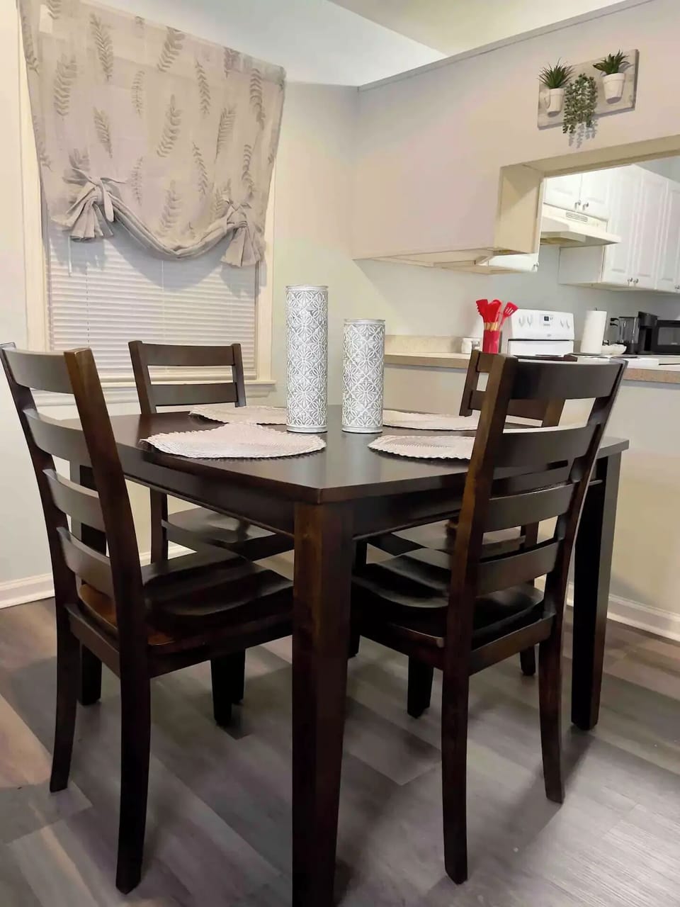 4 chairs at the dining room table, and 2 barstools at the counter